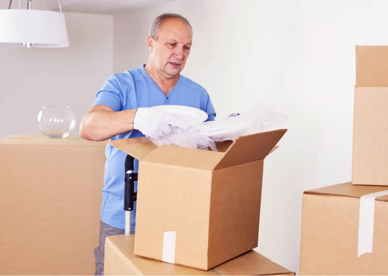 Individual handling moving boxes at home