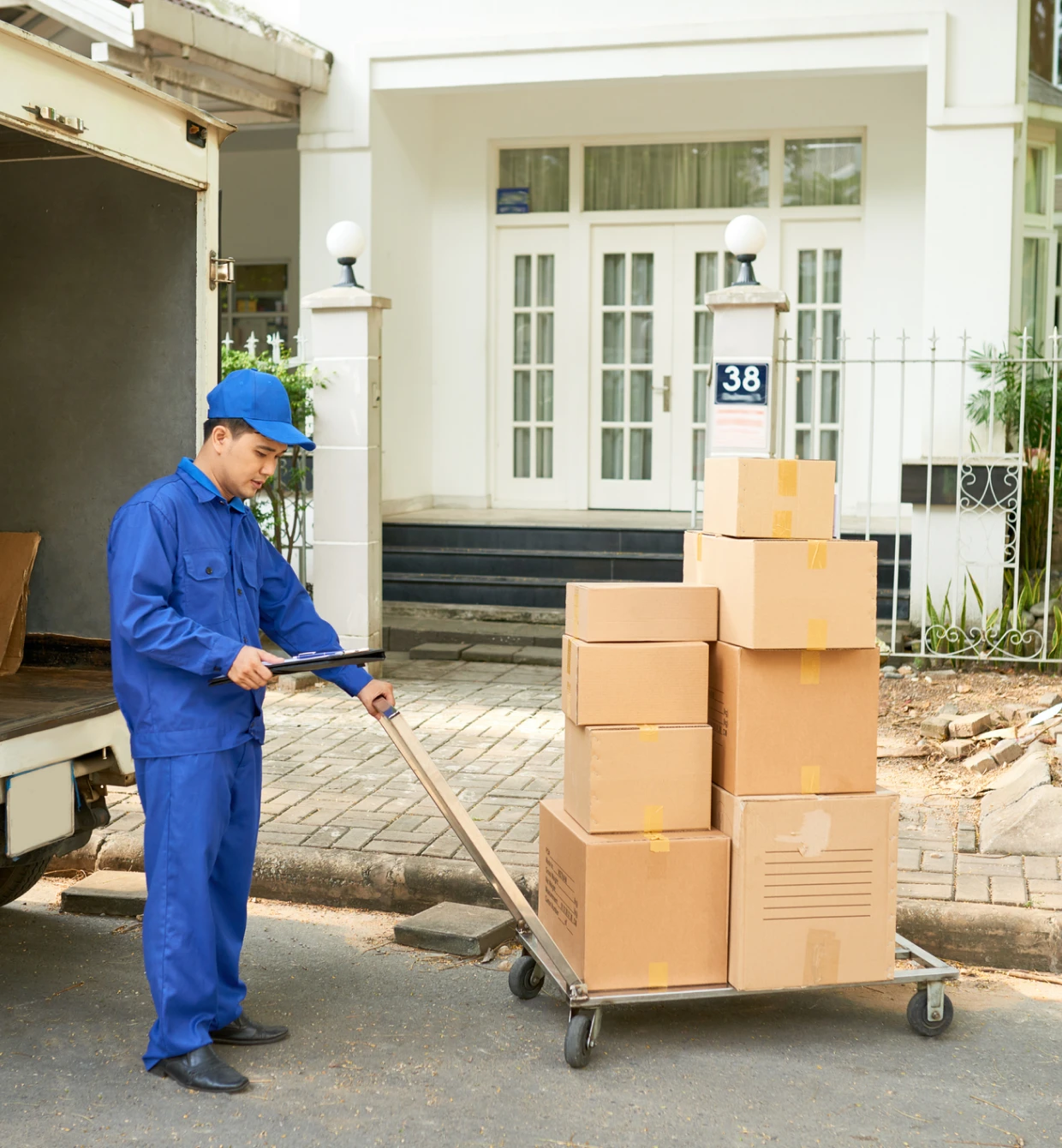 Movers loading household belongings carefully into the moving truck.